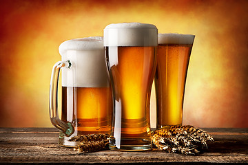 Image showing Three beers and wheat