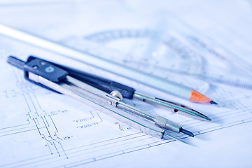 Image showing Compass and ruler lie on the drawing