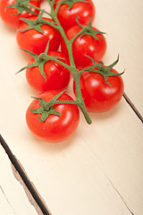 Image showing fresh cherry tomatoes on a cluster