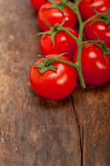 Image showing fresh cherry tomatoes on a cluster