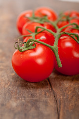 Image showing fresh cherry tomatoes on a cluster