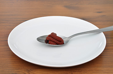 Image showing Spoon with tomato puree
