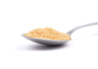Image showing Brown cane sugar on spoon