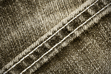 Image showing part of old jeans background with diagonal seams