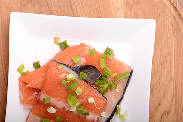 Image showing Slice of red fish salmon on white plate