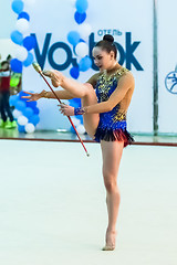 Image showing Young pretty girl shows exercise with ball