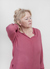 Image showing elderly woman with neck pain