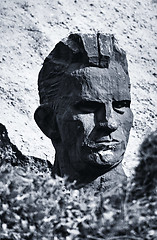 Image showing Man\'s head burried in junk