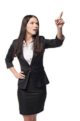 Image showing Business woman pointing at blank copy space