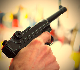 Image showing Parabellum automatic pistol in a human hand