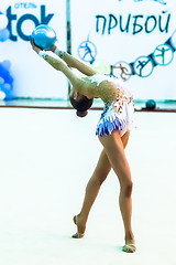 Image showing Young attractive girl shows exercise with ball