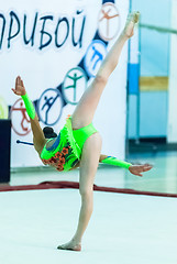 Image showing Young beautiful girl shows exercise with maces