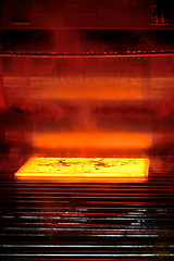 Image showing hot steel on conveyor