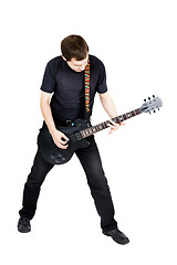 Image showing young man with an electric guitar. Isolated