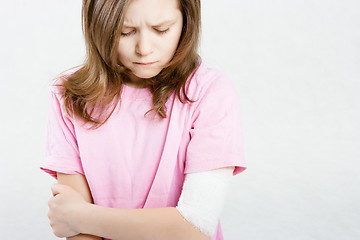 Image showing girl with a bandage on his hand. limb injuries