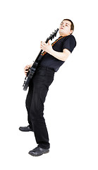 Image showing young man with an electric guitar. Isolated