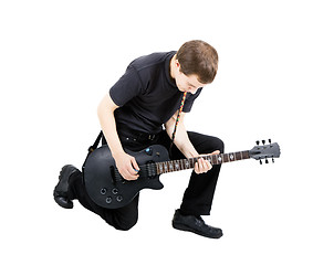 Image showing young man with an electric guitar. Isolated