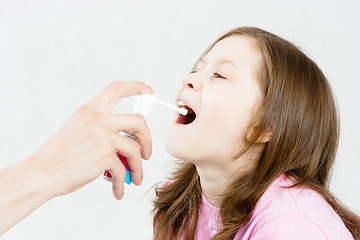 Image showing Treatment of sore throat. Medicinal spray