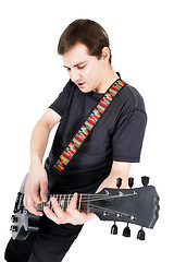 Image showing young man with an electric guitar. Isolated