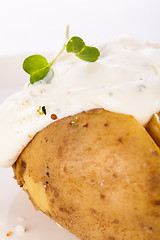 Image showing Baked jacket potato with sour cream sauce