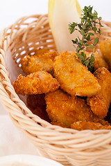 Image showing Crumbed chicken nuggets in a basket