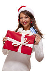 Image showing Woman holding a Christmas gift and bank card