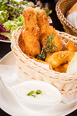 Image showing Crisp crunchy golden chicken legs and wings