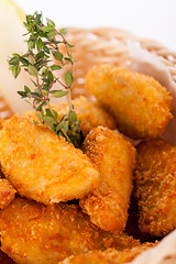 Image showing Crumbed chicken nuggets in a basket