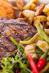 Image showing Platter of mixed meats, salad and French fries