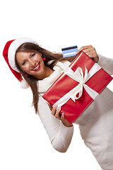 Image showing Woman holding a Christmas gift and bank card