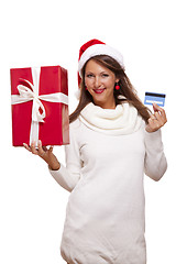 Image showing Woman holding a Christmas gift and bank card