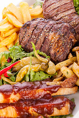 Image showing Platter of mixed meats, salad and French fries