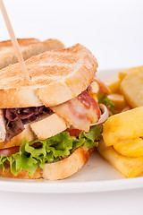 Image showing Club sandwich with potato French fries