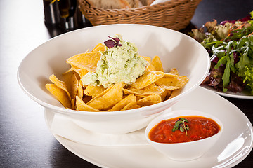 Image showing Crisp corn nachos with guacamole sauce