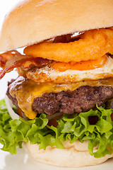 Image showing Delicious egg and bacon cheeseburger