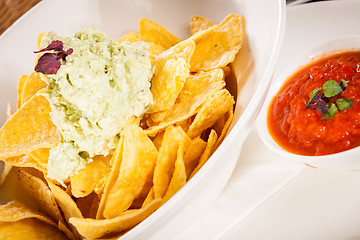 Image showing Crisp corn nachos with guacamole sauce