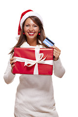 Image showing Woman holding a Christmas gift and bank card