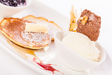 Image showing tasty sweet pancakes with vanilla icecream and topping