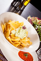 Image showing Crisp corn nachos with guacamole sauce