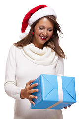 Image showing Beautiful vivacious woman with a Christmas gift