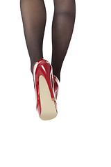 Image showing Woman Legs Wearing Red Shoes and Gray Stockings