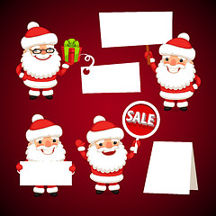 Image showing Set of Cartoon Santa Clauses Holding a White Empty Banners