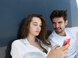 Image showing young couple making selfie together at home