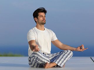 Image showing young man practicing yoga