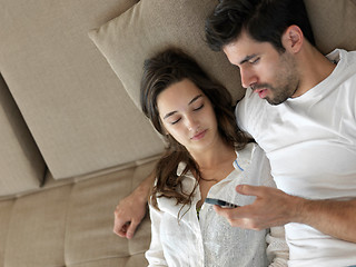 Image showing young couple making selfie together at home