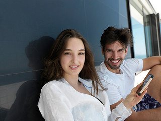 Image showing young couple making selfie together at home