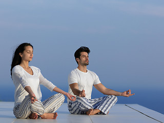 Image showing young couple practicing yoga