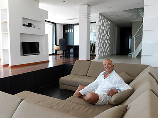 Image showing Portrait of senior man relaxing in sofa