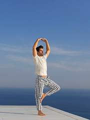 Image showing young man practicing yoga