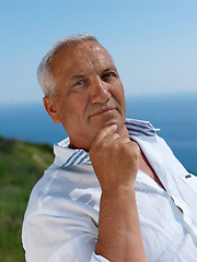 Image showing senior man sitting outside